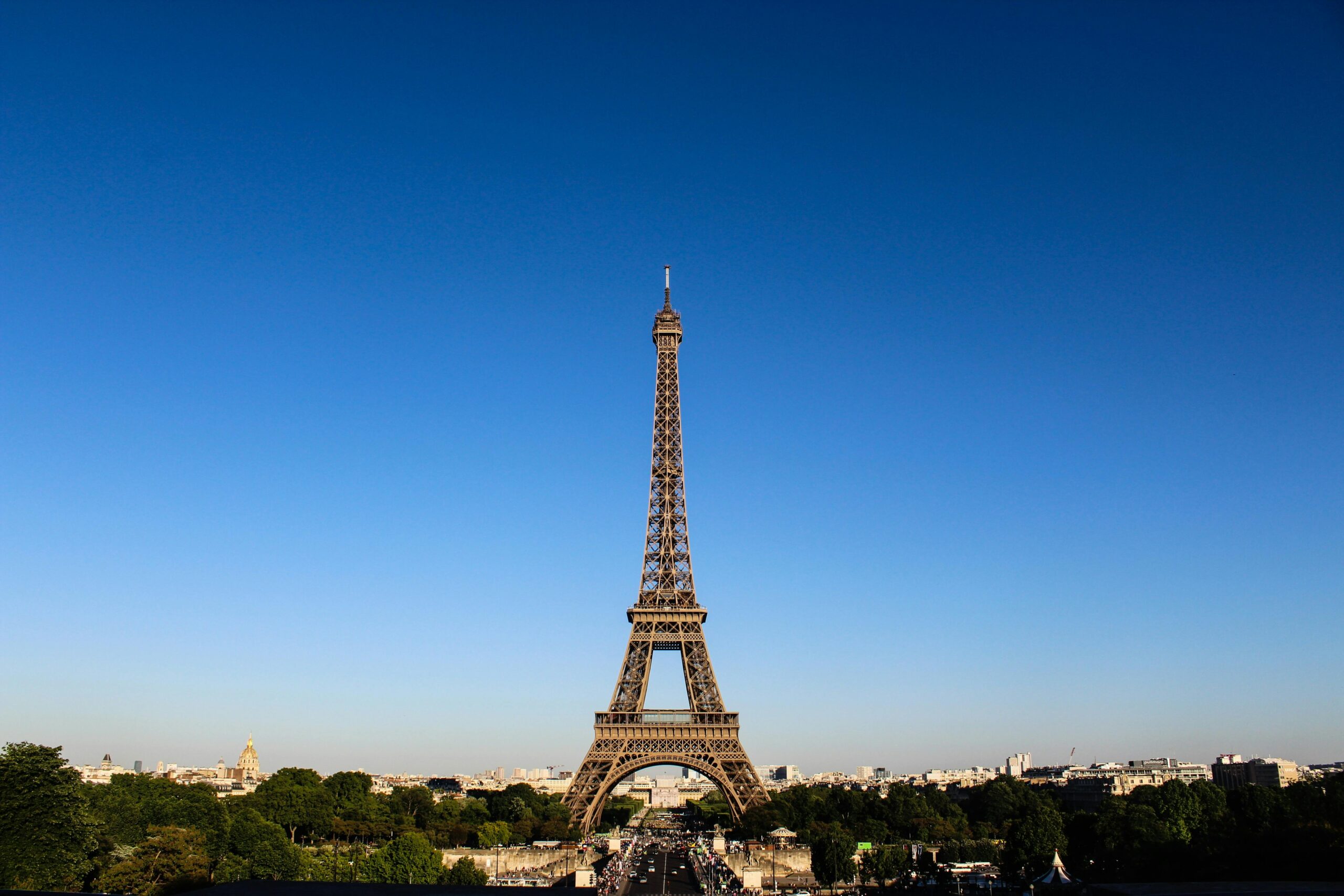 Stunning daylight shot capturing the Eiffel Tower with clear blue skies in Paris.